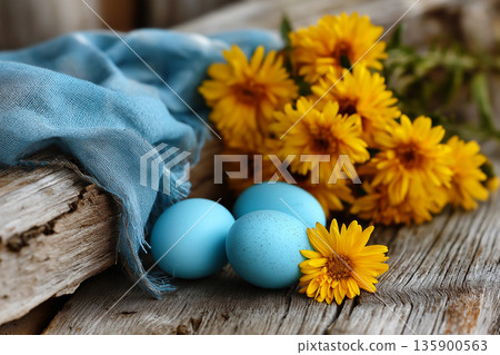 Blue easter eggs with yellow daffodils rustic 135900563