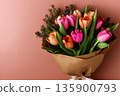 Tulips bouquet wrapped in kraft paper 135900793