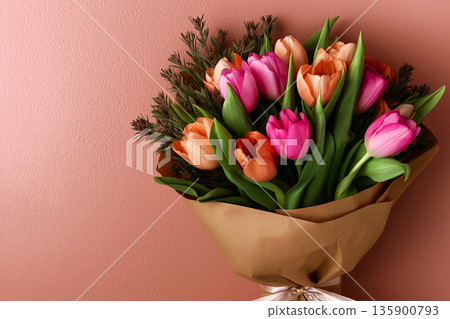 Tulips bouquet wrapped in kraft paper 135900793