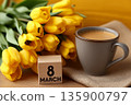 Coffee cup with yellow tulips and march calendar 135900797