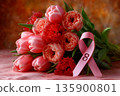 Pink tulips bouquet with breast cancer awareness ribbon 135900801