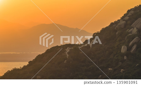 Jan 10 2026 Golden Sun Sets Above Tranquil Hills At Nai Wan Bay Jan 10 2026 Golden Sun Sets Above Tranquil Hills At Nai Wan Bay 135901091
