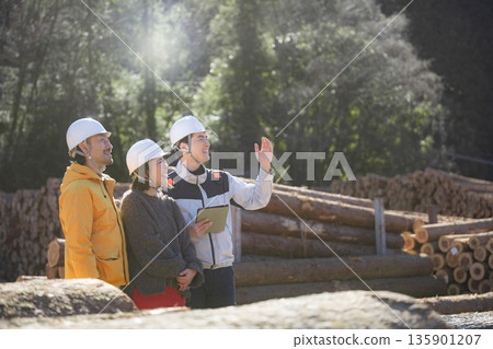 A client inspects the timber and building materials used to build a custom-built home. We guide the client through the process of building their own home, starting with the building materials. 135901207