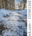 Low angle view of cleared walkway to houise front door after snow storm winter scene 135901308