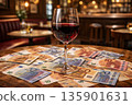Red wine glass sits on cash at bar during wine crisis sale event 135901631