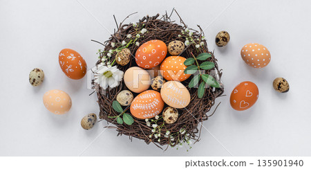 Easter nest with hand-painted eggs on a light background Easter nest with hand-painted eggs on a light background 135901940