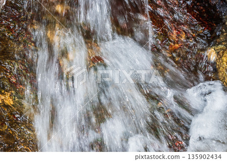 Autumn mountain: Close-up of a stream flowing down 01 135902434