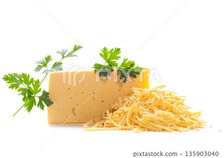 Dairy product with grated cheese pile and parsley leaf Dairy product with grated cheese pile and parsley leaf 135903040