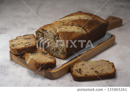 Delicious homemade banana bread sliced and ready to enjoy Delicious homemade banana bread sliced and ready to enjoy 135903261