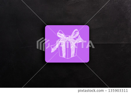 A purple box with a bow on it A purple box with a bow on it 135903311