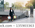 Happy woman with shopping bags enjoying in shopping. 135903363