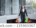 Happy woman with shopping bags enjoying in shopping. 135903367