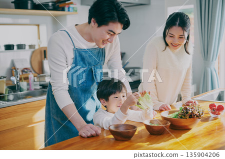 Parents who cook in the kitchen Parents who cook in the kitchen 135904206