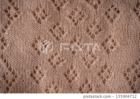 Texture Sweater Knit Fabric with Diamond Pattern background Texture Sweater Knit Fabric with Diamond Pattern background 135904712