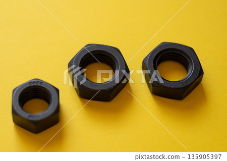 Nuts on yellow background Nuts on yellow background 135905397