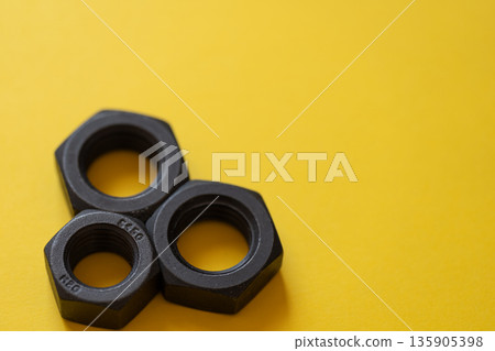Nuts on yellow background Nuts on yellow background 135905398