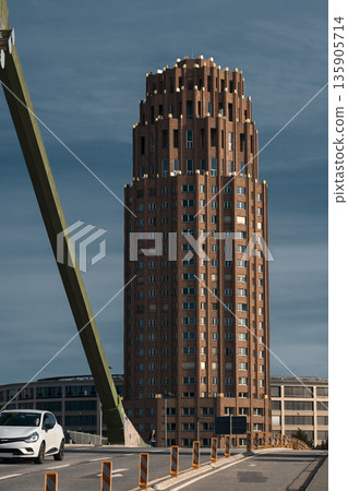 Modern urban architecture with tall brick tower Modern urban architecture with tall brick tower 135905714
