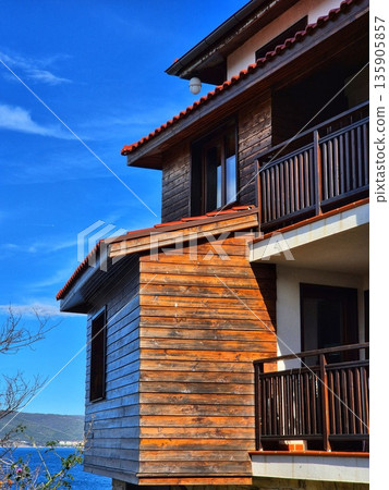 Modern Seaside Architecture with Wooden Facade and Balconies in Traditional Bulgarian Style Modern Seaside Architecture with Wooden Facade and Balconies in Traditional Bulgarian Style 135905857