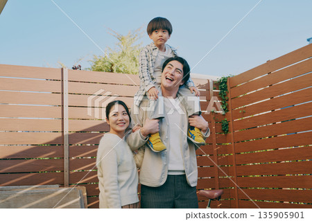 Family Parent and child carrying a shoulder 135905901