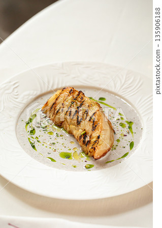 Grilled cabbage steak with creamy sauce 135906188