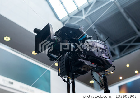 Close-up of a professional television camera. Close-up of a professional television camera. 135906905