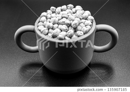 Beautiful organic dried chickpea beans consisting of raw bengal legume pea 135907185