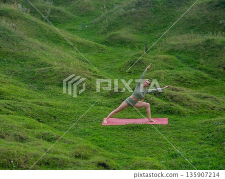 Caucasian woman doing yoga outdoors. Caucasian woman doing yoga outdoors. 135907214