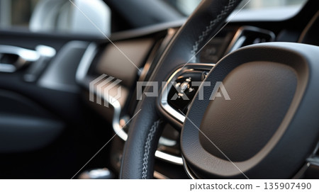 Close view of steering wheel and interior details in a modern car during daylight 135907490