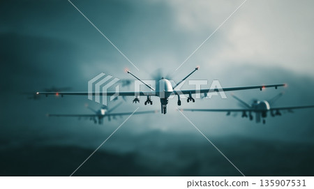 Drones flying in formation over a cloudy sky during a military exercise in the evening light Drones flying in formation over a cloudy sky during a military exercise in the evening light 135907531