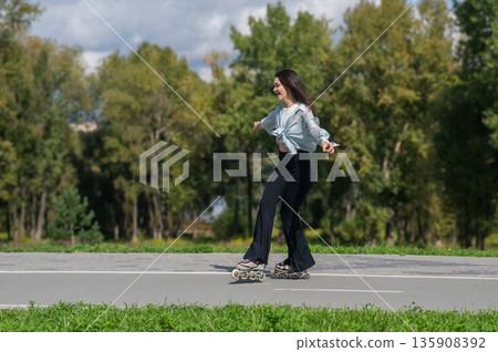 Caucasian woman roller skating in park. Caucasian woman roller skating in park. 135908392
