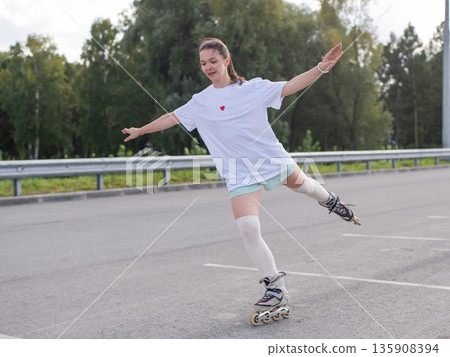 Caucasian woman in shorts roller skating. Caucasian woman in shorts roller skating. 135908394
