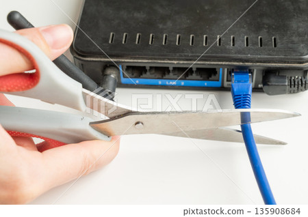 Scissors cut the router cables.  135908684