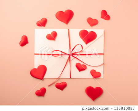 Love letter envelope with red hearts and ribbon Love letter envelope with red hearts and ribbon 135910083
