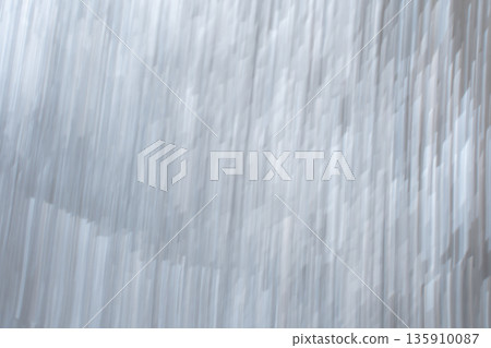 Vertical brushed metallic foil texture with linear abstract pattern 135910087