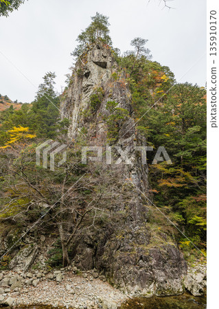 The rocky cliffs and autumn foliage of the Kurofuchi canyon in Sandankyo, a gorge in Akiota Town, Yamagata County, Hiroshima Prefecture, Japan The rocky cliffs and autumn foliage of the Kurofuchi canyon in Sandankyo, a gorge in Akiota Town, Yamagata County, Hiroshima Prefecture, Japan 135910170
