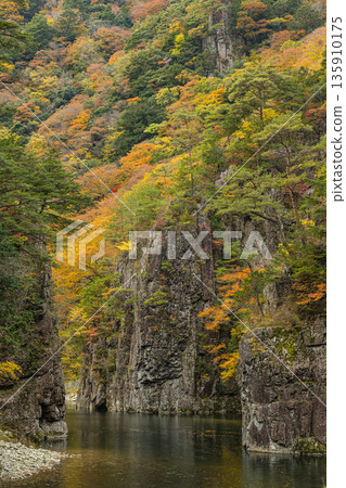 The rocky cliffs and autumn foliage of the Kurofuchi canyon in Sandankyo, a gorge in Akiota Town, Yamagata County, Hiroshima Prefecture, Japan The rocky cliffs and autumn foliage of the Kurofuchi canyon in Sandankyo, a gorge in Akiota Town, Yamagata County, Hiroshima Prefecture, Japan 135910175