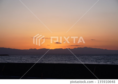 Sunset over the mountains and the sea 135910648
