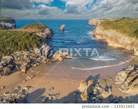 Seascape in the morning. Rocky sea coast. Beach Playa de Buelna, Asturias, Spain Seascape in the morning. Rocky sea coast. Beach Playa de Buelna, Asturias, Spain 135911601