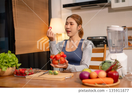 Fit woman enjoys healthy fruit breakfast after yoga training. fitness, nutrition, healthy lifestyle. Fit woman enjoys healthy fruit breakfast after yoga training. fitness, nutrition, healthy lifestyle. 135911877