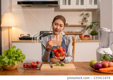 Fit woman enjoys healthy fruit breakfast after yoga training. fitness, nutrition, healthy lifestyle. Fit woman enjoys healthy fruit breakfast after yoga training. fitness, nutrition, healthy lifestyle. 135911878