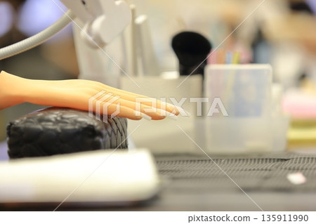 A hand mannequin for practicing nail art A hand mannequin for practicing nail art 135911990