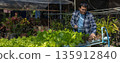 Man farmer checking of organic Organic vegetables freshly harvested from a farm.  135912840