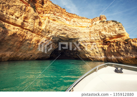 Coastal rocky seascape, view of Praia da Marinha beach and Benagil in the Algarve region in the Atlantic Ocean, Portugal, Europe. Boat excursion along the coast 135912880