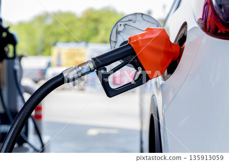 Refill and filling Oil Gas Fuel at station. Gas station - refueling. Refill and filling Oil Gas Fuel at station. Gas station - refueling. 135913059