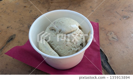 Pistachio ice cream in a cup Pistachio ice cream in a cup 135913894