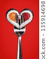 heart-shaped sushi rolls on a fork, generative AI 135914698