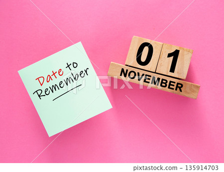 Date November 01 to remember concept with sticky note and wooden calendar Date November 01 to remember concept with sticky note and wooden calendar 135914703