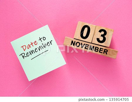 Date November 03 to remember concept with sticky note and wooden calendar Date November 03 to remember concept with sticky note and wooden calendar 135914705