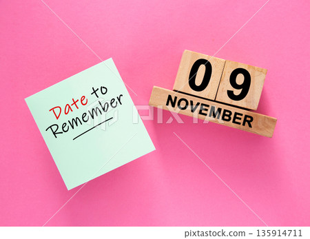 Date November 09 to remember concept with sticky note and wooden calendar Date November 09 to remember concept with sticky note and wooden calendar 135914711