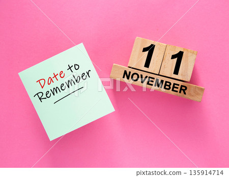 Date November 11 to remember concept with sticky note and wooden calendar 135914714